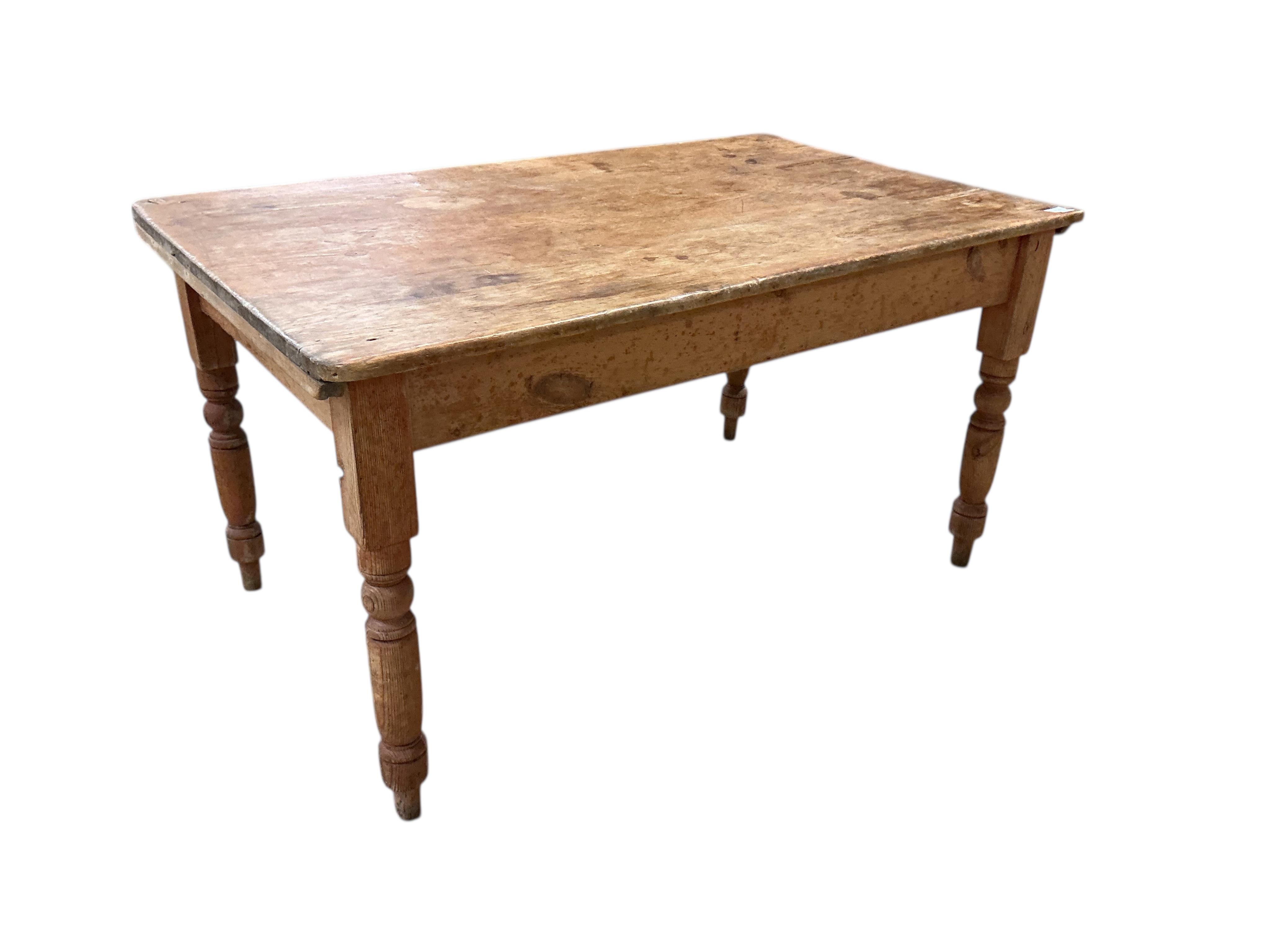 A Victorian rectangular pine kitchen table, width 133cm, depth 82cm, height 72cm together with four Victorian Windsor elm and beech comb back kitchen chairs
